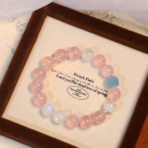 The tube is as clear as pure natural water, and it contains pink crystal and a blue moonstone bracelet.